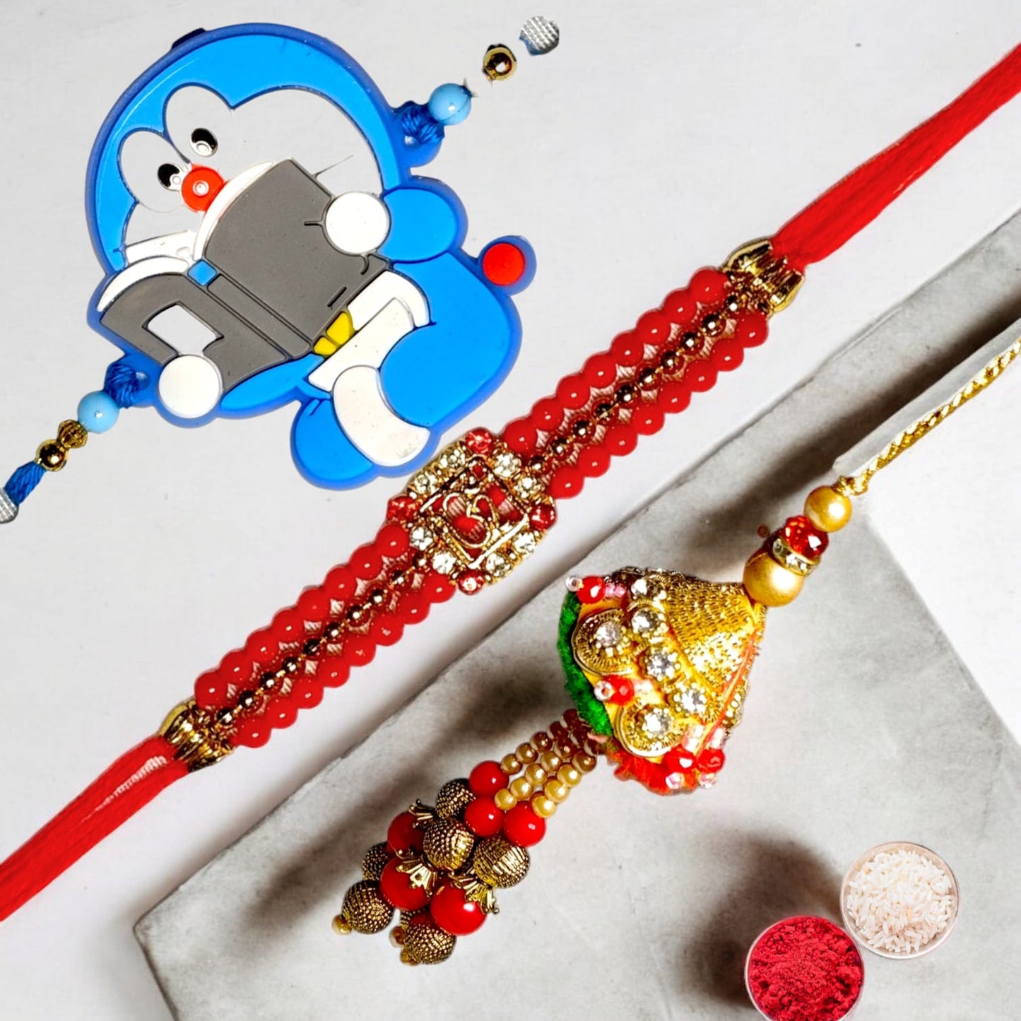 Bhaiya Bhabhi kids rakhi set bbk (1BHAIYA RAKHI, 1BHABHI RAKHI, 1 KIDS RAKHI, ROLI CHAWAL PACK)