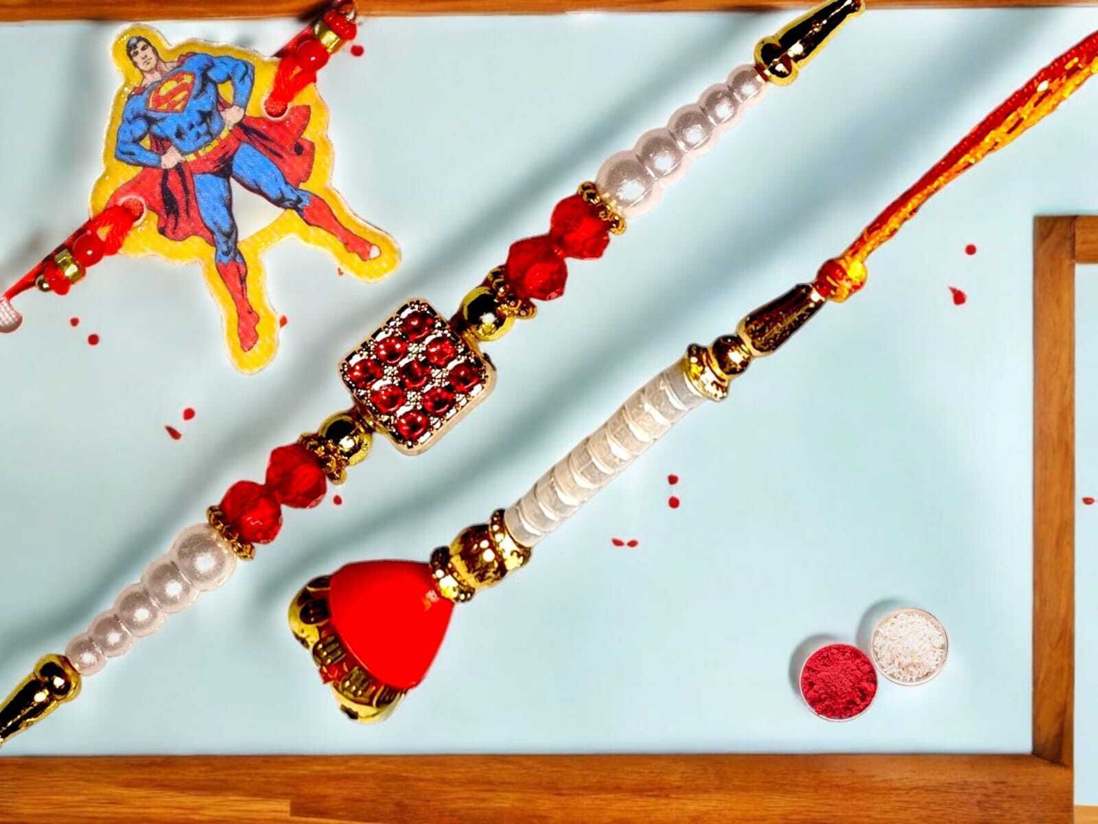 SUNINOW Bhaiya Bhabhi bbk-18 Pearl Rakhi Set (1 rakhi for brother ; 1 rakhi for bhabhi ; 1 rakhi for kids)